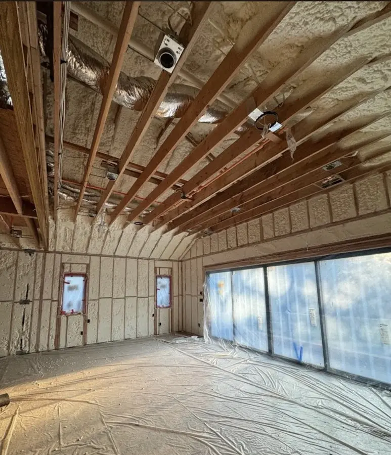 Interior walls and ceiling insulated with spray foam during new construction in Kula